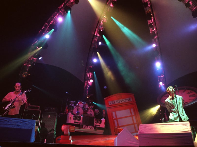 Oasis recreate their latest album cover on stage at Sheffield Arena in 1997