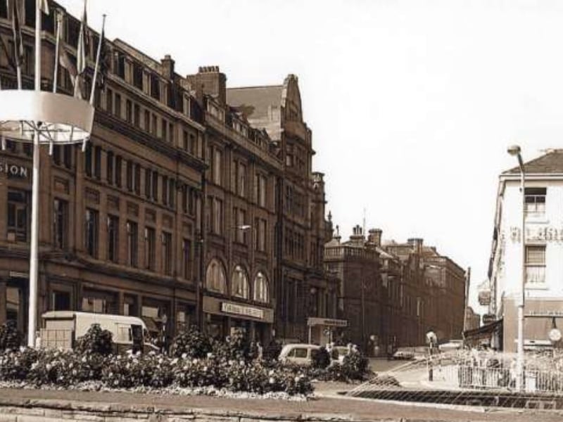 Leopold Street, Sheffield city centre, seen from Fargate, some time between 1960 and 1979, showing the Goodwin Fountain, Wilson Peck music warehouse, Marshall and Snelgrove fashion shop, the Grand Hotel and Education Department offices