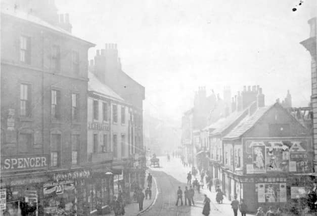 West Bar, Sheffield, viewed from the junction with Coulston Street, some time between 1851 and 1899, showing Spencer Brothers, grocers; and J. M.Furness, chemist, among other businesses