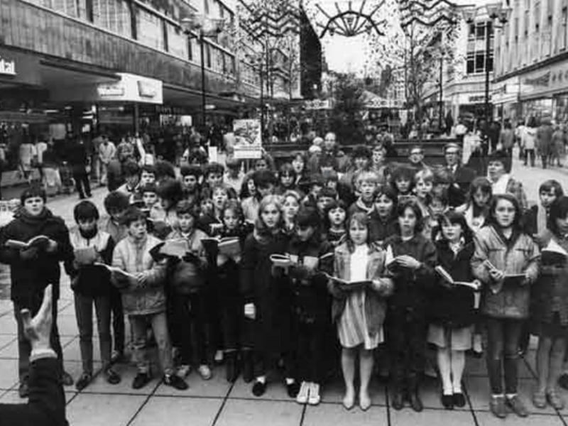 Rowlinson Secondary School choir carol singing on The Moor, Sheffield city centre, in December 1984