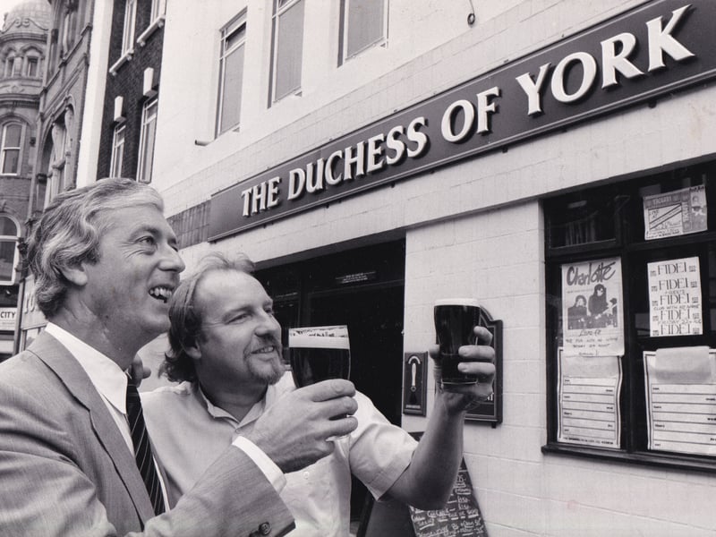Chris Fawdington, left, tenanted sales manager of John Smith's Tadcaster brewery, and Mike Longbottom, landlord of the newly-named The Duchess of York pub on Vicar Lane. Leeds, in August 1986