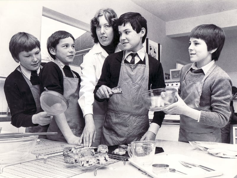 Pamela Evans, head of home economics, with pupils Graham Learmonth, Jason Hogan, Nigel Brindley and Steven Oldfield at High Storrs School, Sheffield, in March 1980