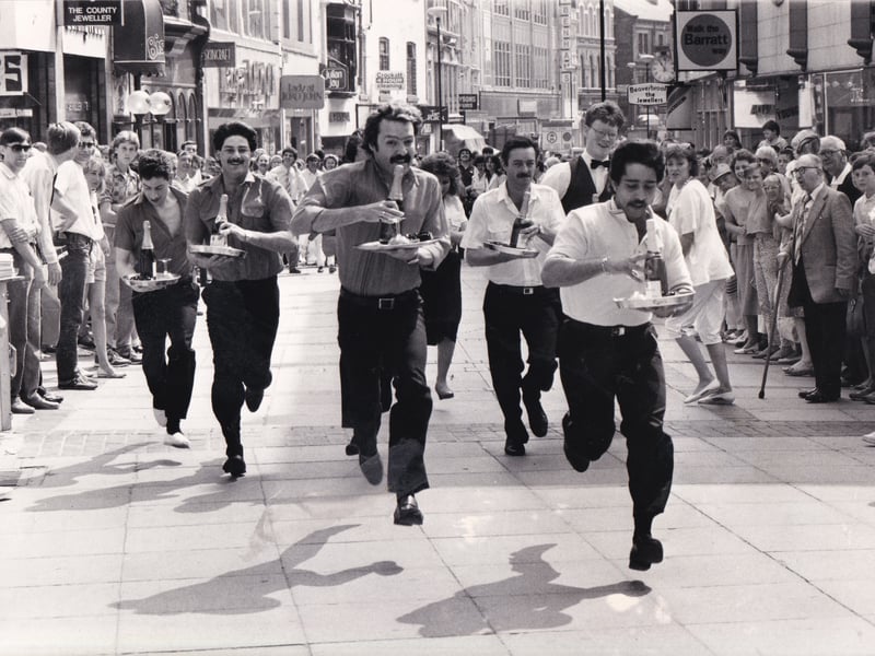 June 1986 and shopping came to a standstill as a group of waiters showcased their racing skills. The first ever Leeds waiters' race , a curtain-raiser to the Lord Mayor's Parade was started by Miss Leeds Metro '86, Julie Garnett, and finished under three minutes later outside the Bistro Fiori.