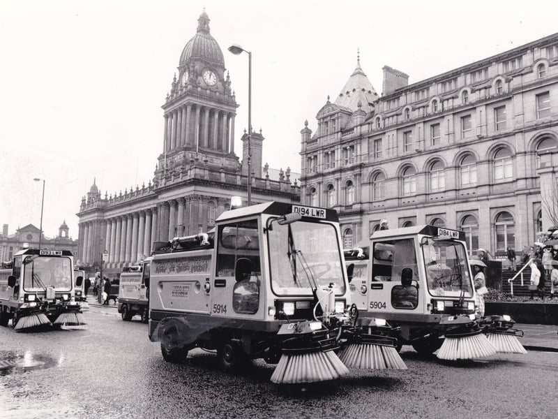 A fleet of new street cleaners are pictured as they cruise past Leeds Town Hall in April 1987