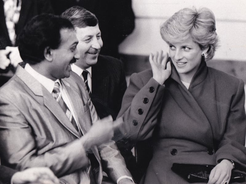 Princess Diana makes a gesture during a visit to Leeds Incorporated Institution for the Blind and the Deaf in March 1987, much to the delight of Leeds Deaf Social Club chairman Evindra Wickremaratne and Martin Smith, principal of the institution