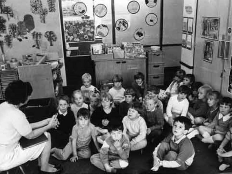 A teacher with pupils at Ecclesfield Junior and Infant School, Sheffield, in 1986