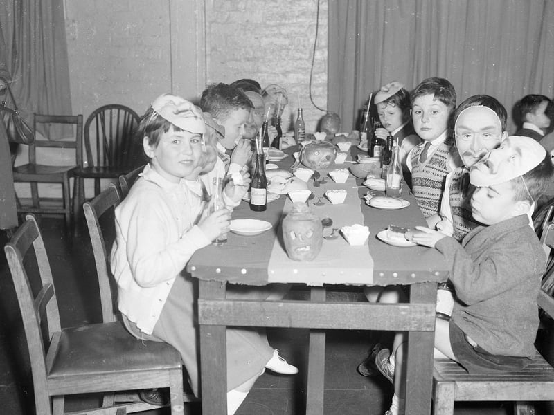 A Halloween Party for orphans with turnip lanterns on the table in Edinburgh in 1962. 