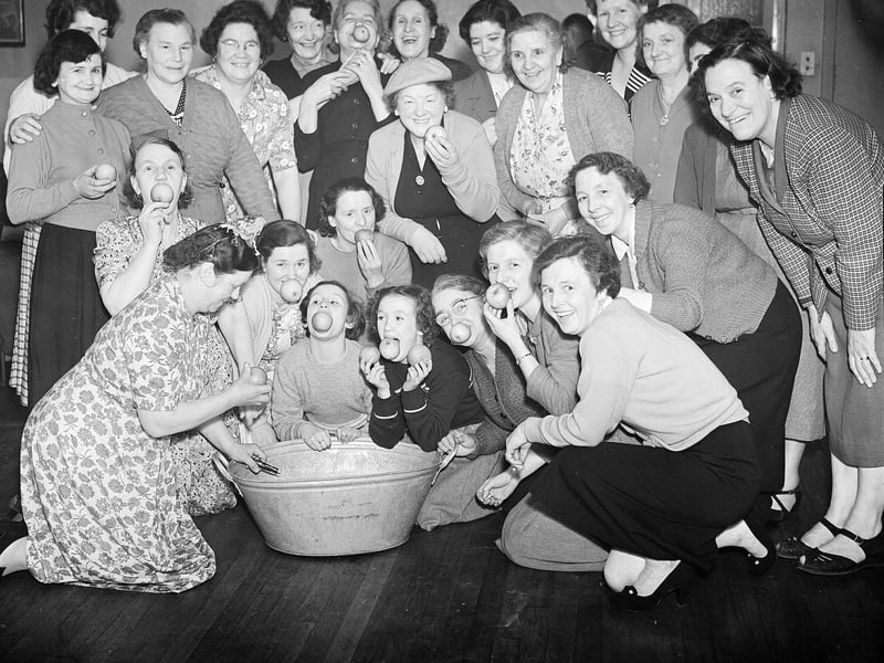 Dooking for apples at the Canongate Women's Social Club in 1956.