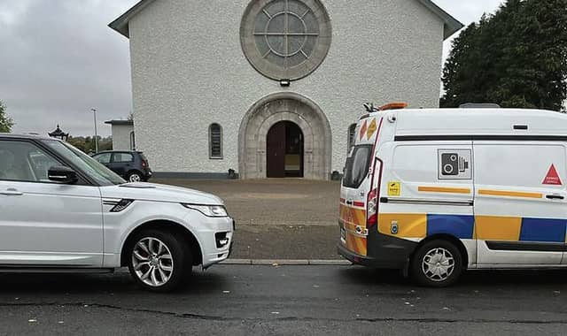 Speeding van located in front of parked car outside Williamstown Church.