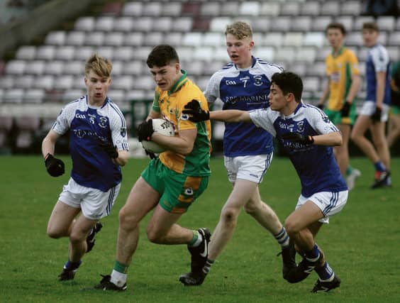 Corofin’s Cormac Greaney is surrounded by Killannin's Brian Mitchell, Luke O’Halloran and Kento O’Connor during the County U-19 A Football Final at Pearse Stadium on Saturday. Photos; Iain McDonald.