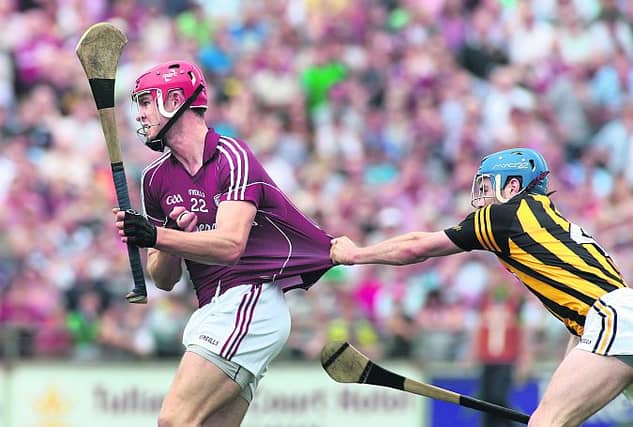 Galway's Jonathan Glynn has the fabric of his jersey tested by Kilkenny's Brian Kennedy during Sunday's Leinster semi-final in Tullamore. Photo: Joe O'Shaughnessy.