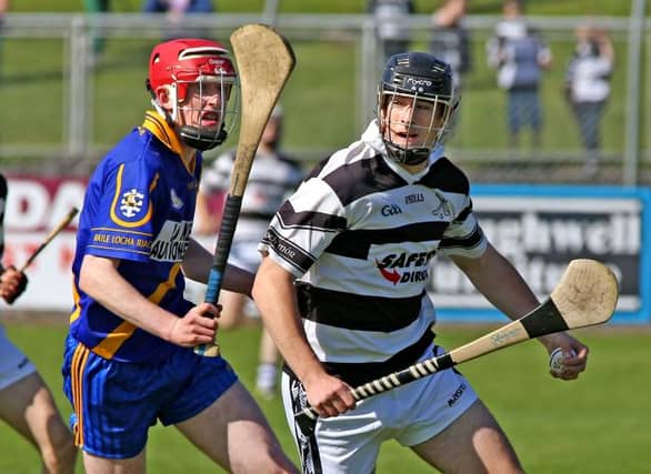 Turloughmore's Padraig Kearney breaking away from Loughrea's Gearoid Loughnane during the counhty minor A hurling final at Kenny Park last Saturday.