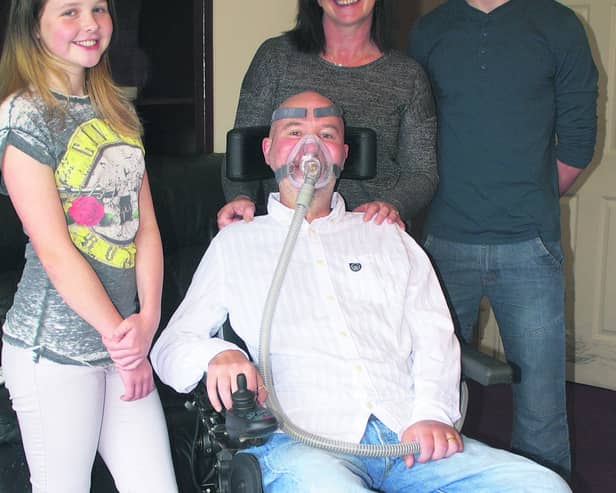 Motor Neurone Disease sufferer Andrew Lydon with his wife Sally, daughter Molly (12) and son Seosamh (17)