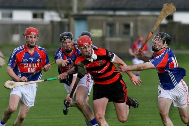 Cappataggle's Paul Claffey is chased by Ahascragh-Fohenagh's Stephen Kelly, Luke Cosgrove and Padraig Mannion during the County Intermediate hurling championship final replay in Ballinasloe last Sunday.