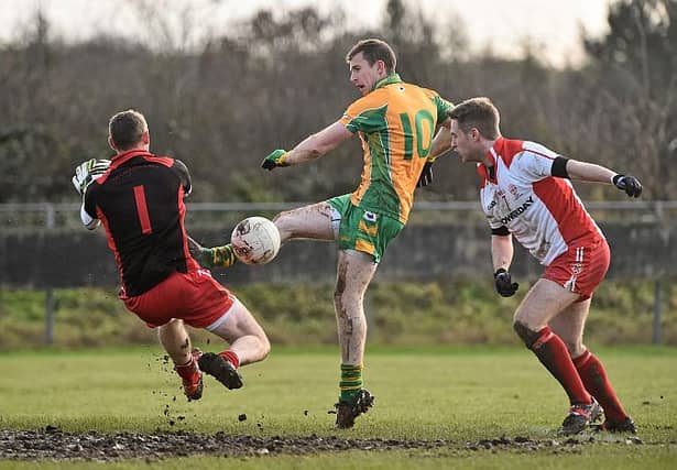Tir Chonaill Gaels goalkeeper Declan Traynor thwarts Corofin's Gary Sice during Sunday's All-Ireland Club football quarter-final in Ruislip last Sunday. Photo: David Maher/Sportsfile.