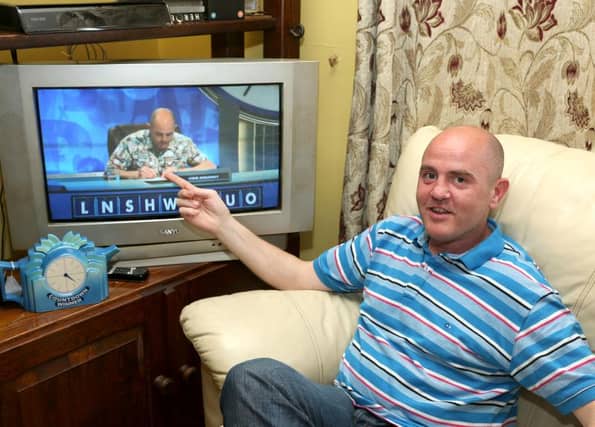 Liam Moloney watches a recording of one of his appearances on Countdown.