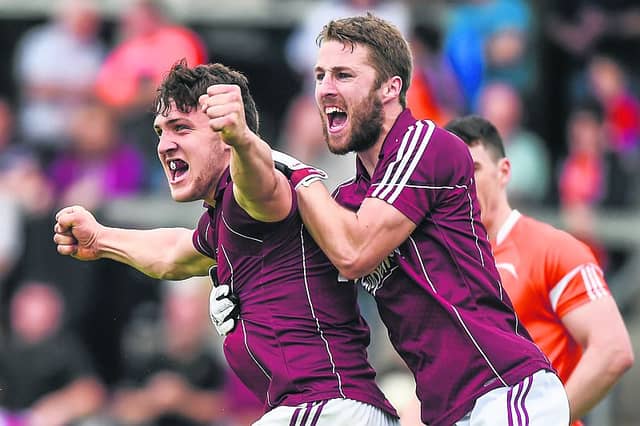 Galway full forward Damien Comer celebrates with team-mate Michael Lundy after scoring the only goal of Sunday's All-Ireland football qualifier at the Athletic Grounds. Photo: Matt Browne/ Sportsfile.