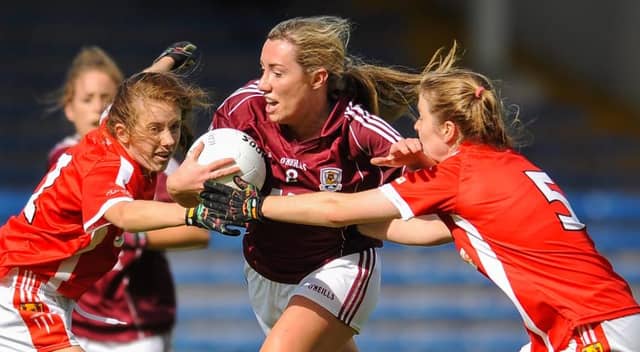 Galway's Megan Glynn tries to break through the challenges of Cork's Asling Kelleher,right, and Emma Spillane during the All-Ireland Minor Ladies Football Final at Semple Stadium last Monday. Photo: Eoin Noonan/Sportsfile.