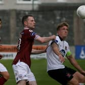 Galway United's Jason Molloy and Dundalk's John Mountney in action in Monday night's EA Sports Cup semi-final.