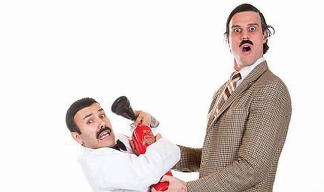 Re-enacting Manuel and Basil's antics during the fire extinguisher scene in the famous Fawlty Towers episode about the Germans.