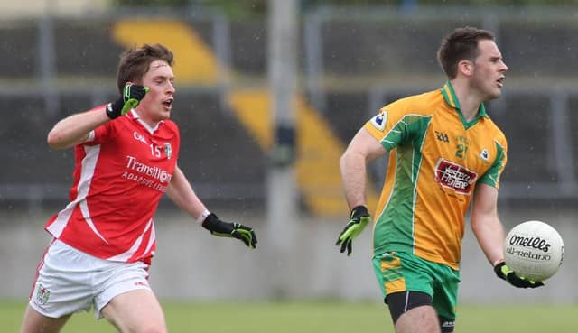 Corofin's Kevin Murphy breaking away from Tuam Stars' Conor Doherty during Sunday's senior football championship replay at Tuam Stadium.
