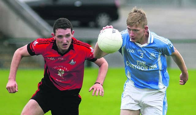 Cortoon Shamrocks Matthew Concannon is about to be challenged by An Cheathru Rua's Coilin O Domhnaill during the clubs' senior football quarter-final at Pearse Stadium on Sunday. Photos: Enda Noone.