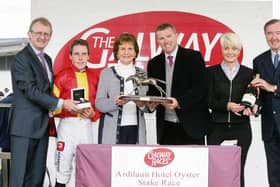 Breda Ryan presents the winning trophy to Mark Weld after Zhukova won the Ardilaun Hotel Oyster Stakes at Ballybrit on Monday. Also included, from left, John Ryan, General Manager, Ardilaun Hotel, Leigh Roche, winning jockey, Maggie Ryan and Dermot Weld, winning trainer.