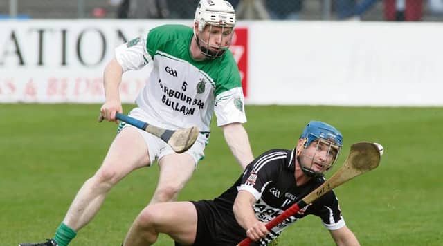 Padraig Pearses Jimmy Gelston comes under pressure from Sarsfields Niall Quinn during Sunday's senior hurling championship quarter-final at Kenny Park. Photo: Joe O'Shaughnessy.