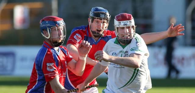 Moycullen's Philip Lydon tries to break free from Abbeyknockmoy's Danny Mullins and Brian Flaherty during Saturday's intermerdiate hurling final at Kenny Park. Photos: Joe O'Shaughnessy.