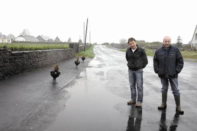 Cllr Pete Roche with Caherlistrane resident Brian Finnegan pictured at the flooding outside his house.
Photo: Johnny Ryan Photography.