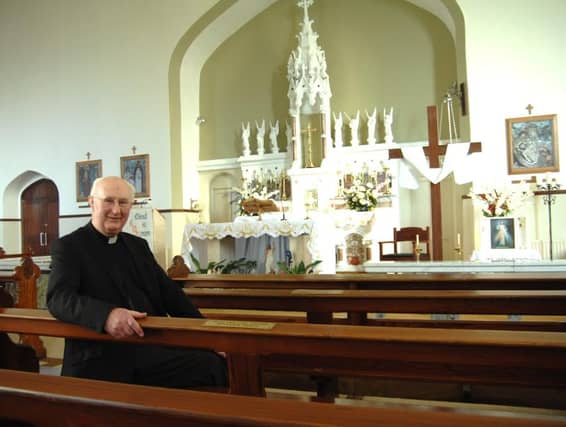 Reunited....Kiltullagh PP Fr Martin McNamara awaiting the return of his stolen Stations of the Cross this week. Photo: Johnny Ryan Photography.