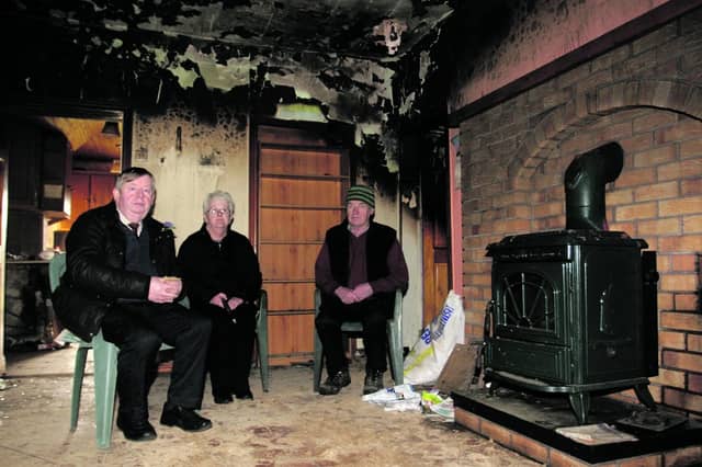 Moylough couple Billy and Marian Staunton access the fire damage to their home in Moylough with Cllr Michael Connolly (left). Photo: David Walsh.