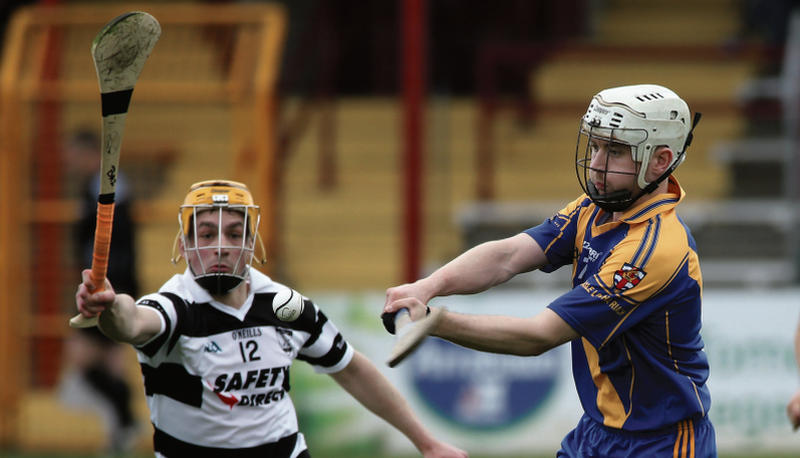 Loughrea's Alan Cormican prepares to clear his lines against Turloughmore's Barry McDonagh during the clubs' championship tie at Kenny Park on Sunday evening. Photos: Joe O'Shaughnessy