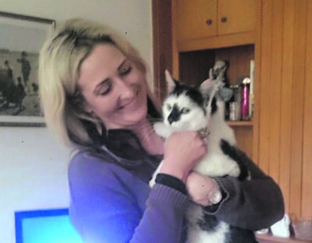 Bobby the cat happily back in the arms of his owner, Ros na Rún star Anna Maria Nic Dhonnacha.