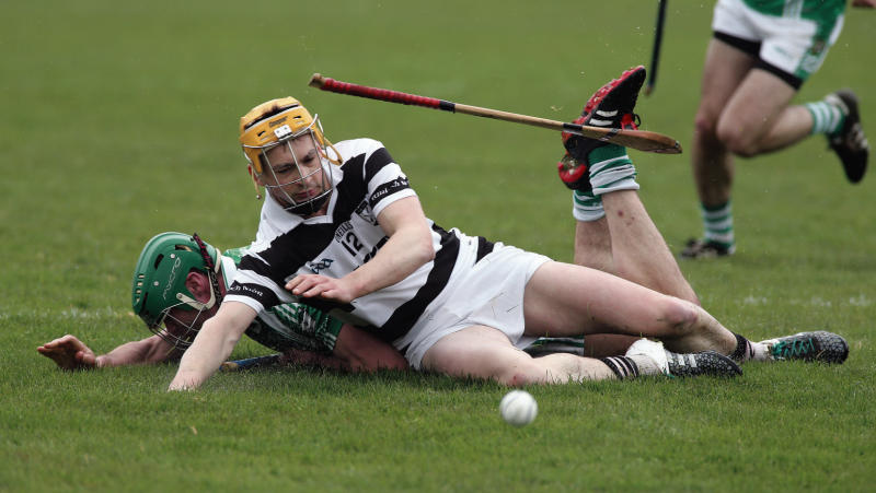 Castlegar's Tomas Mannion and Turloughmore's Barry McDonagh go tumbling in this battle for possession during the clubs' Senior Hurling A Championship tie at Pearse Stadium on Sunday. Photos: Joe O'Shaughnessy.