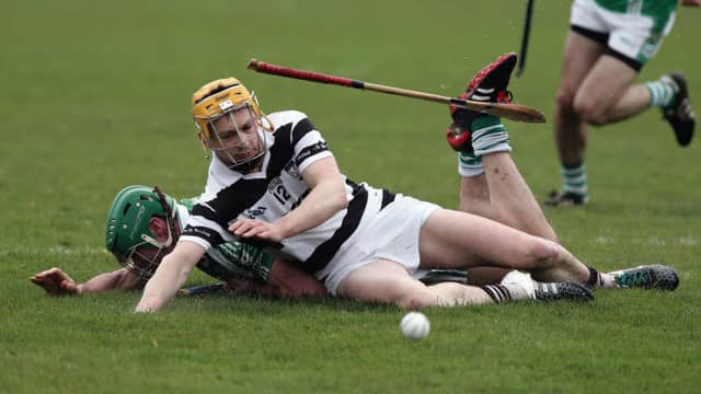 Castlegar's Tomas Mannion and Turloughmore's Barry McDonagh go tumbling in this battle for possession during the clubs' Senior Hurling A Championship tie at Pearse Stadium on Sunday. Photos: Joe O'Shaughnessy.