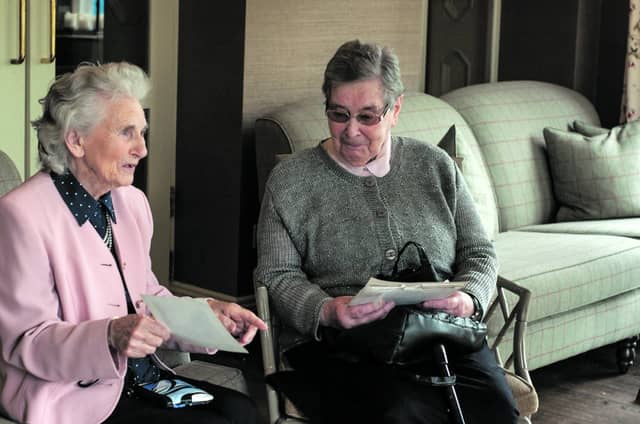 Maureen Breslin and Sheila Hayden reminiscing about times past in the hotel.
