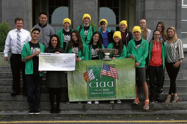Pictured at the presentation of a cheque by students of the Celtic Irish American Academy from Colaiste Einde to Galway Simon were (back – from left) Brian Fahy, Director of Celtic Irish American Academy and teacher at Colaiste Einde; Galway footballer Finian Hanley; Shane Cumaiskey, New York; Nick Kline, Wisconsin; Nia Folan, Katie Hall and Lauren Conway from Colaiste Einde with teacher Marie Walsh; (front) Matt Singer, Amy Lavelle of Galway Simon; Ryleigh Cumaiskey, New York; Emily McNelis, New York; Coleen McNeilis, New York; Eric Egelhaaf, Michigan; Niamh Tierney, Colaiste Einde, and Dr. Johanna Clancy, Director of Celtic Irish American Academy.