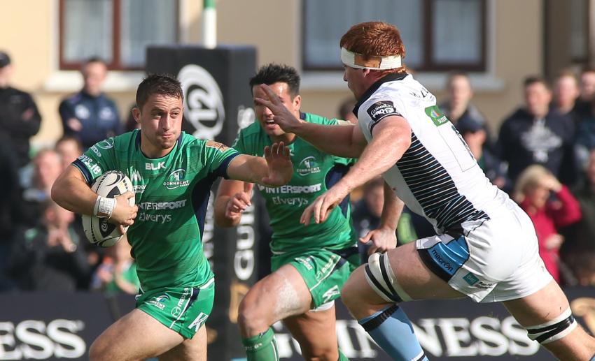 Connacht scrum half Caolin Blade prepares to fend off the challenge of Glasgow Warriors' Rob Harley during Saturday's Guinness PRO12 clash at the Sportsground. Photo: Joe O'Shaughnessy.