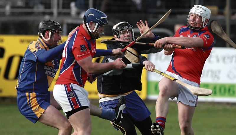 Loughrea's Alan Madden and Eoin Mahony, and the St Thomas' duo of Anthony Kelly and  Bernard Burke in aciton in the group game between the sides back in May.