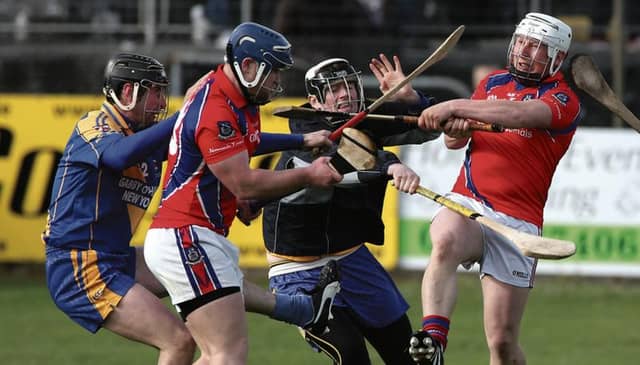 Loughrea's Alan Madden and Eoin Mahony, and the St Thomas' duo of Anthony Kelly and Bernard Burke in aciton in the group game between the sides back in May.
