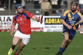 Loughrea's Neil Keary is chased by St Thomas' Bernard Burke during  2025 county senior semi-final at Kenny Park, Athenry