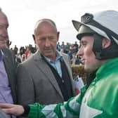 Jockey Seán Flanagan in conversation with Galway trainer Patrick Kelly and owner Philip Reynolds after Presenting Percy won the Corrib Oil Maiden Hurdle at Ballybrit on Sunday. Photos: Iain McDonald.