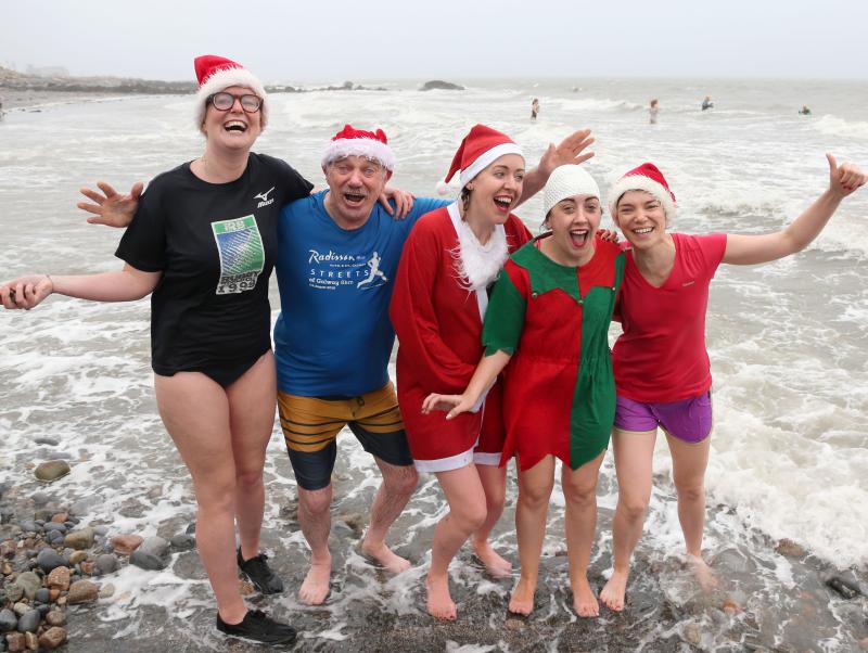 Jane Cassidy, Don Deacy, Eline Murphy, Aoife O'Donovan and Geraldine Deacy at Blackrock for their Christmas Day Swim. Photo: Joe O'Shaughnessy.