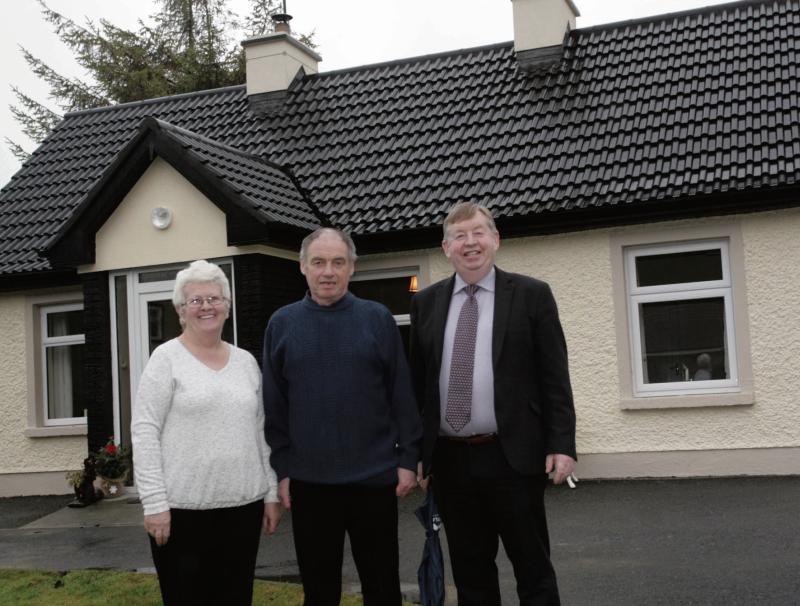 Marian and Billy Staunton pictured with Chairman of Galway County Council Michael Connolly outside their newly renovated home in Moylough. Photo: David Walsh.