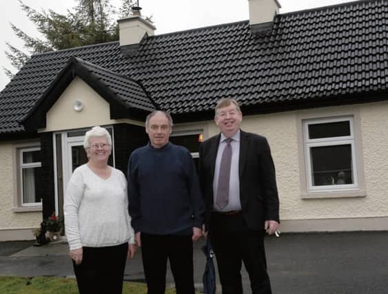 Marian and Billy Staunton pictured with Chairman of Galway County Council Michael Connolly outside their newly renovated home in Moylough. Photo: David Walsh.