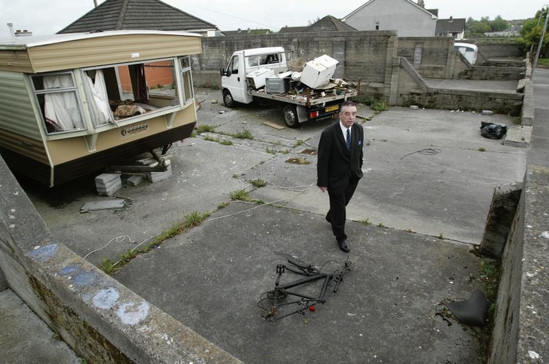 Councillor Padraig Conneely examines living conditions at a hardstand in Rahoon.