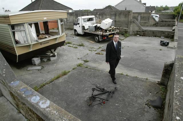 Councillor Padraig Conneely examines living conditions at a hardstand in Rahoon.