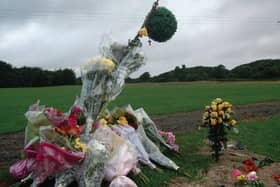 Flowers mark where the fatal accident occurred.