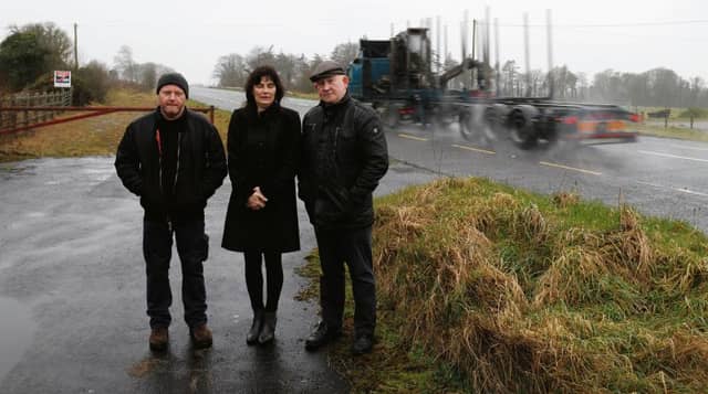 Paul Brogan, Valerie Seal and John Burke from Aughrim who are protesting against the provision of a weighbridge for heavy goods vehicles in the area. Photo: Gerry Stronge.